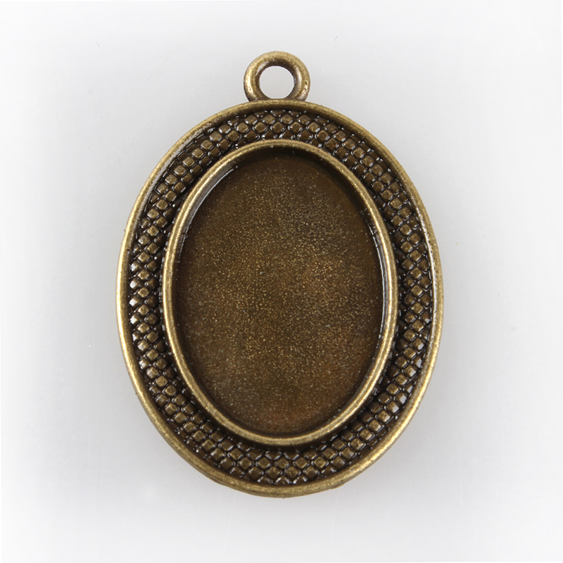 Medál alap antik bronz ovál díszes 25x18mm 1db